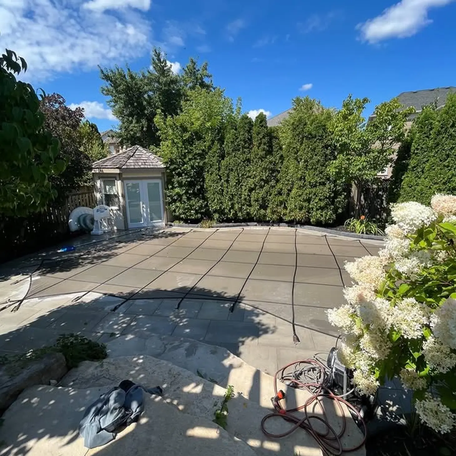 A backyard with a covered pool